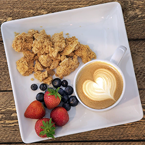 Sqaure plate with berries, GoodiKrunch and a capppuccino